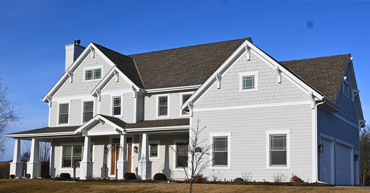White custom home exterior painting feature in Menomonee Falls WI