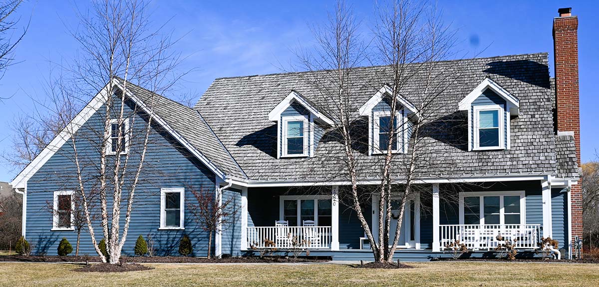 Blue exterior home painting project on W Knightsbridge Dr in Mequon WI