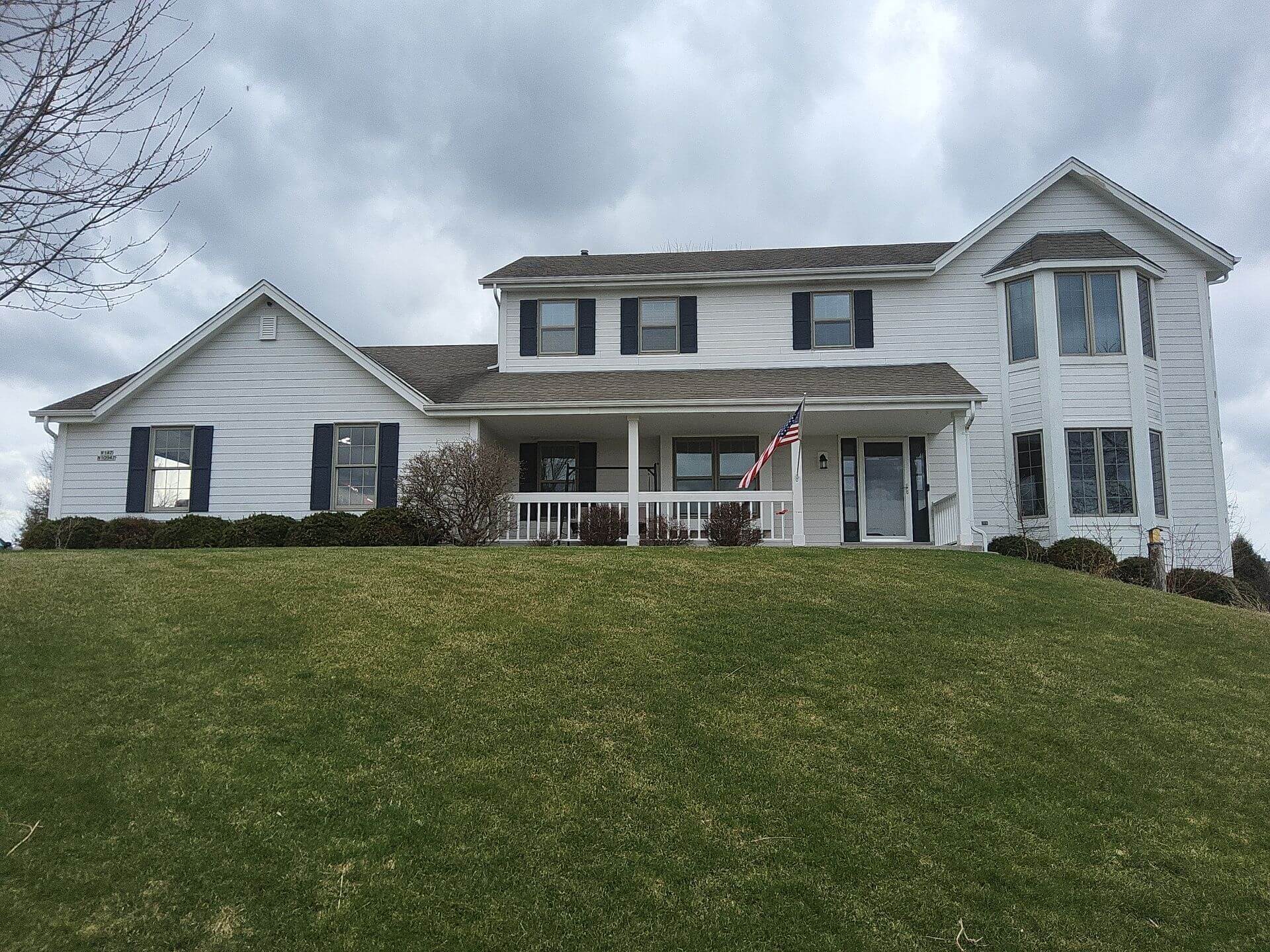 Front view of a Germantown WI home before exterior painting by Empire Painting