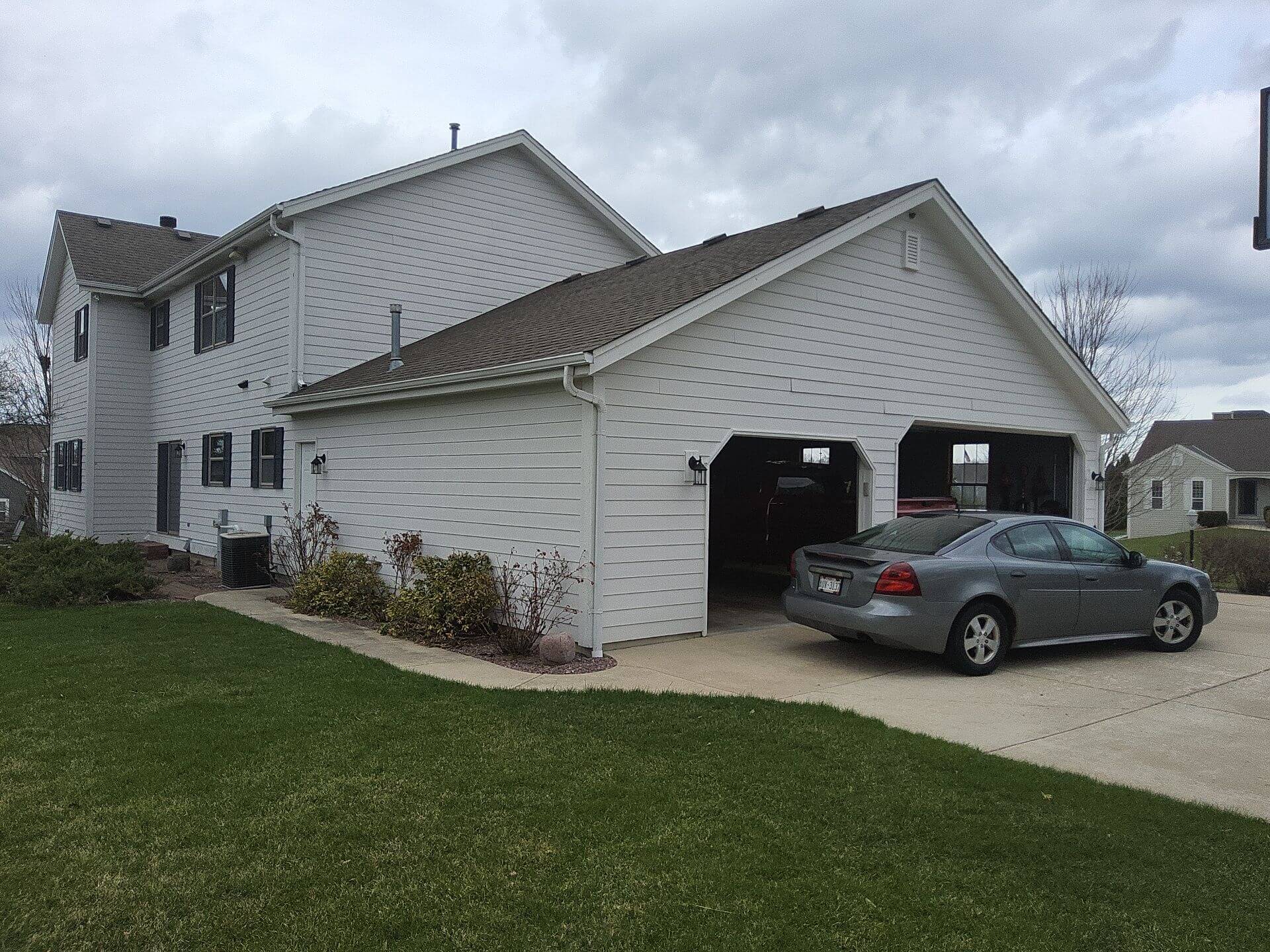 Garage and side exterior of a Germantown WI home before exterior painting