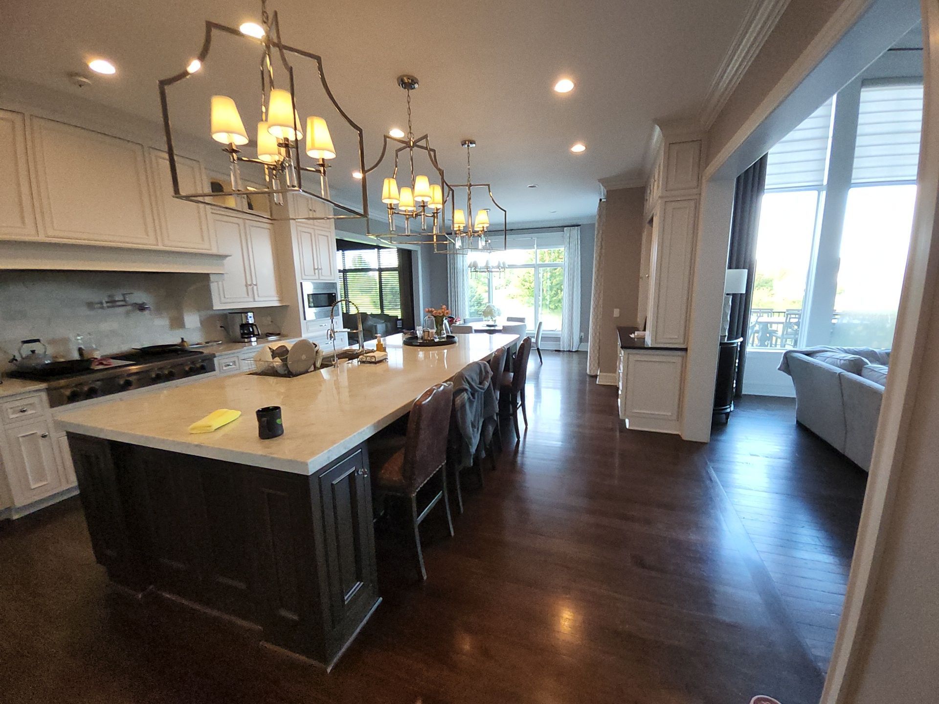 Light cabinet doors and dark island along the working side of a Hartland Wisconsin kitchen