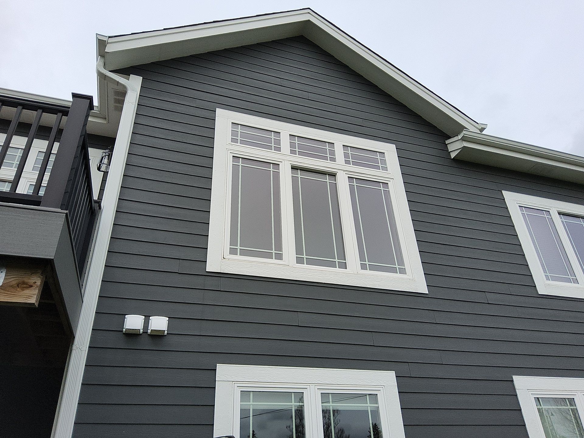 Rear gable and tall windows with white trim in Wales, Wisconsin