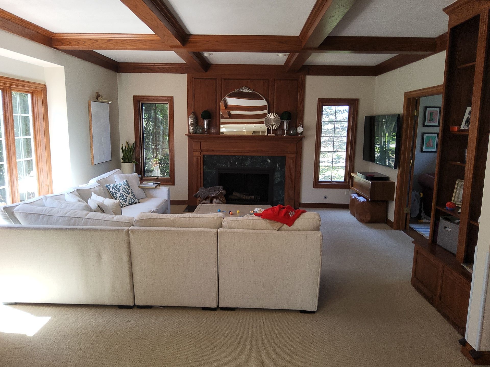 Brookfield interior painting project with detailed wood trim, built-ins and a coffered ceiling