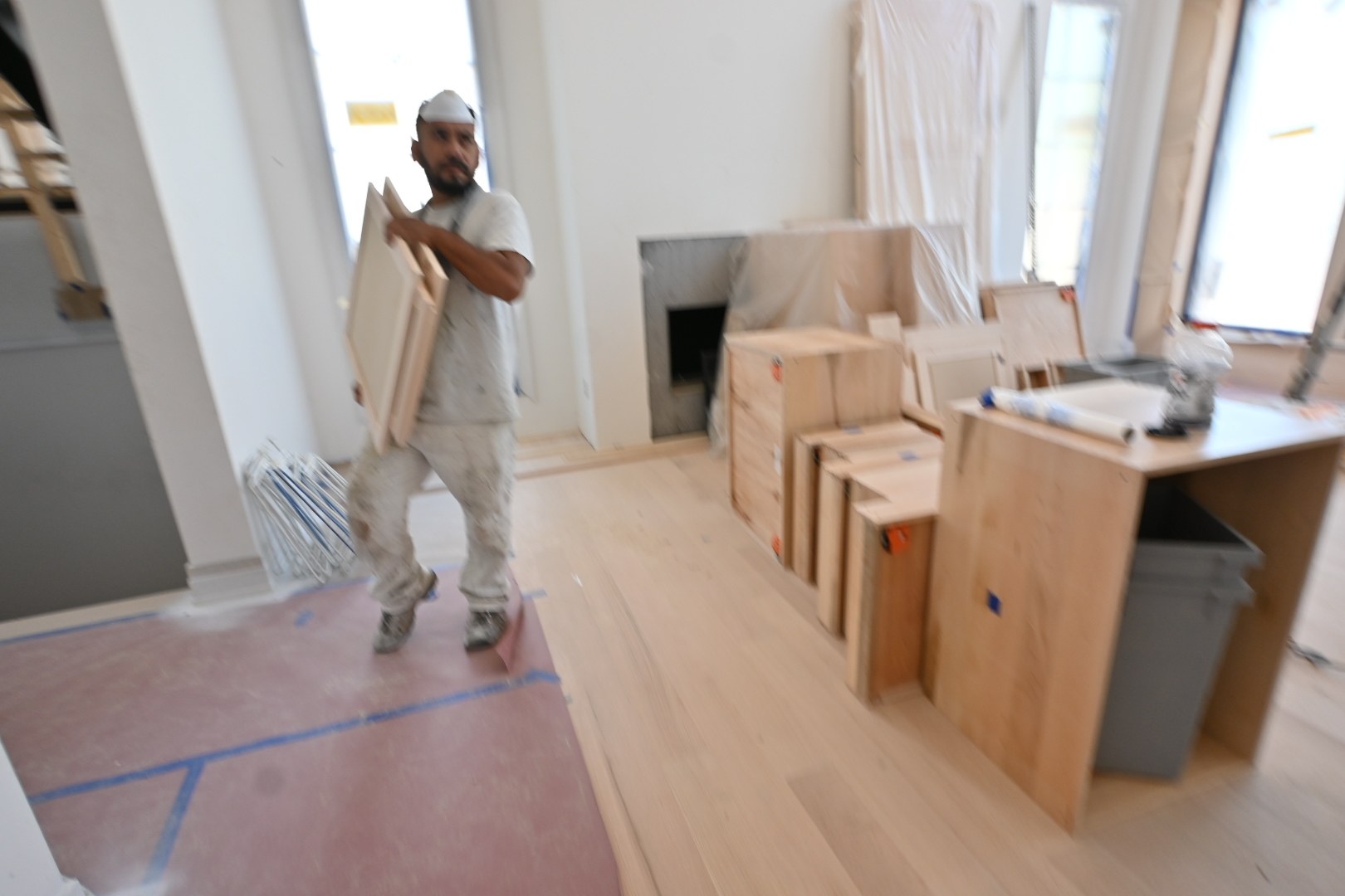 Luis, an Empire Painting employee, at work inside the Whitefish Bay remodel