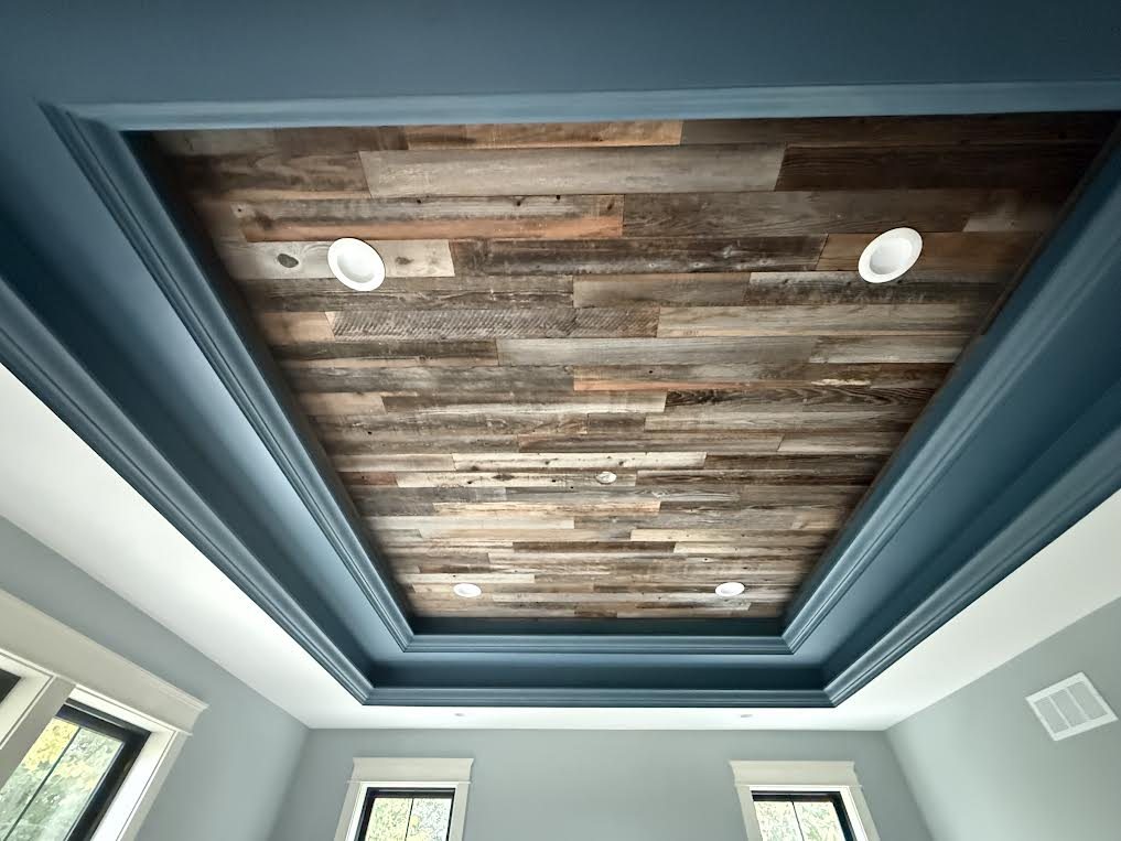 Turquoise painted tray ceiling with a wood inset in Richfield, Wisconsin