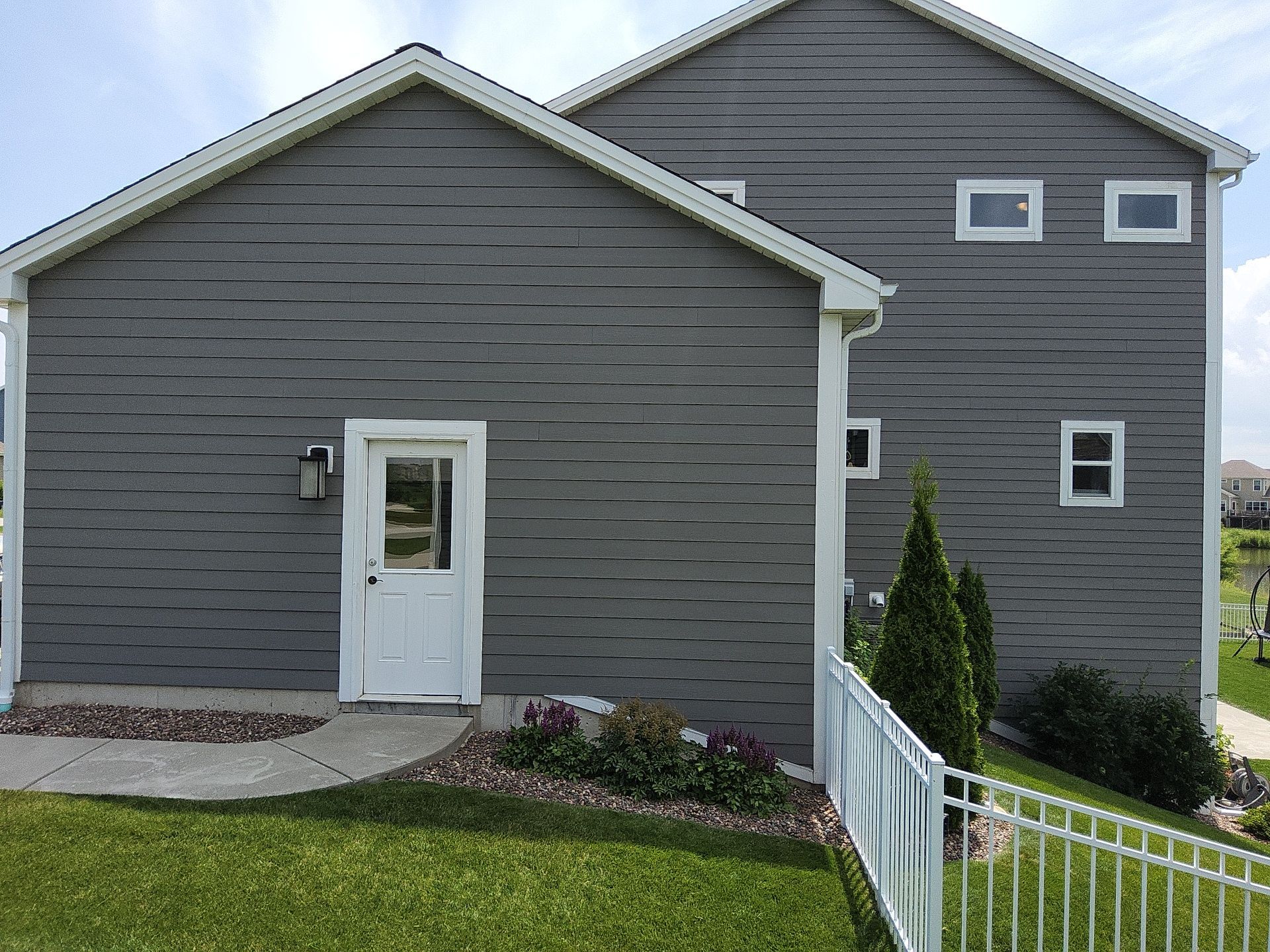 Gray siding and white trim on a Menomonee Falls home