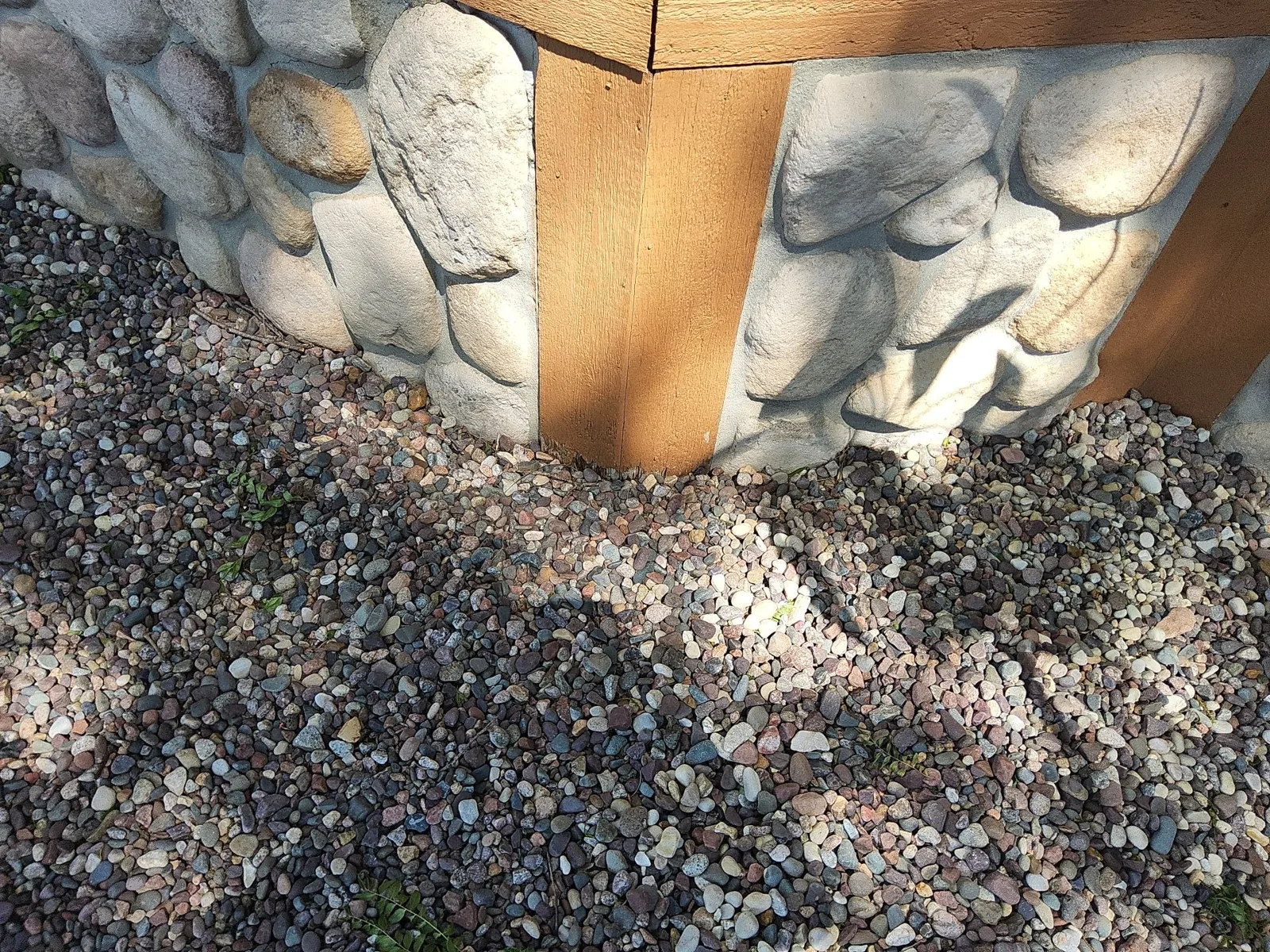 After: cedar trim beside the existing stone base