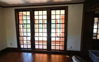 Dark stained French doors and wood trim in a Whitefish Bay home