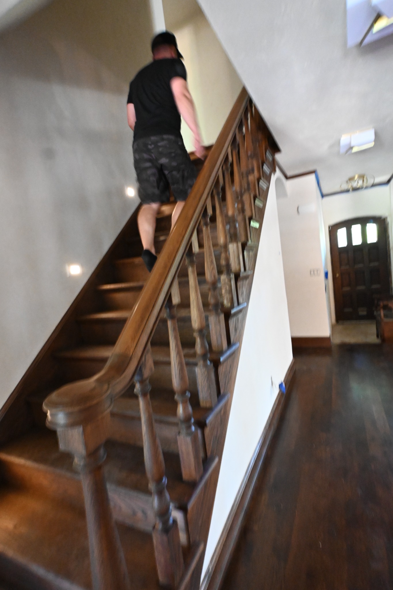 Stained staircase railing and spindles in the Whitefish Bay home