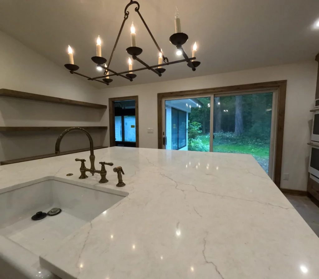 Kitchen island, cabinetry and natural wood trim in a New Berlin home.