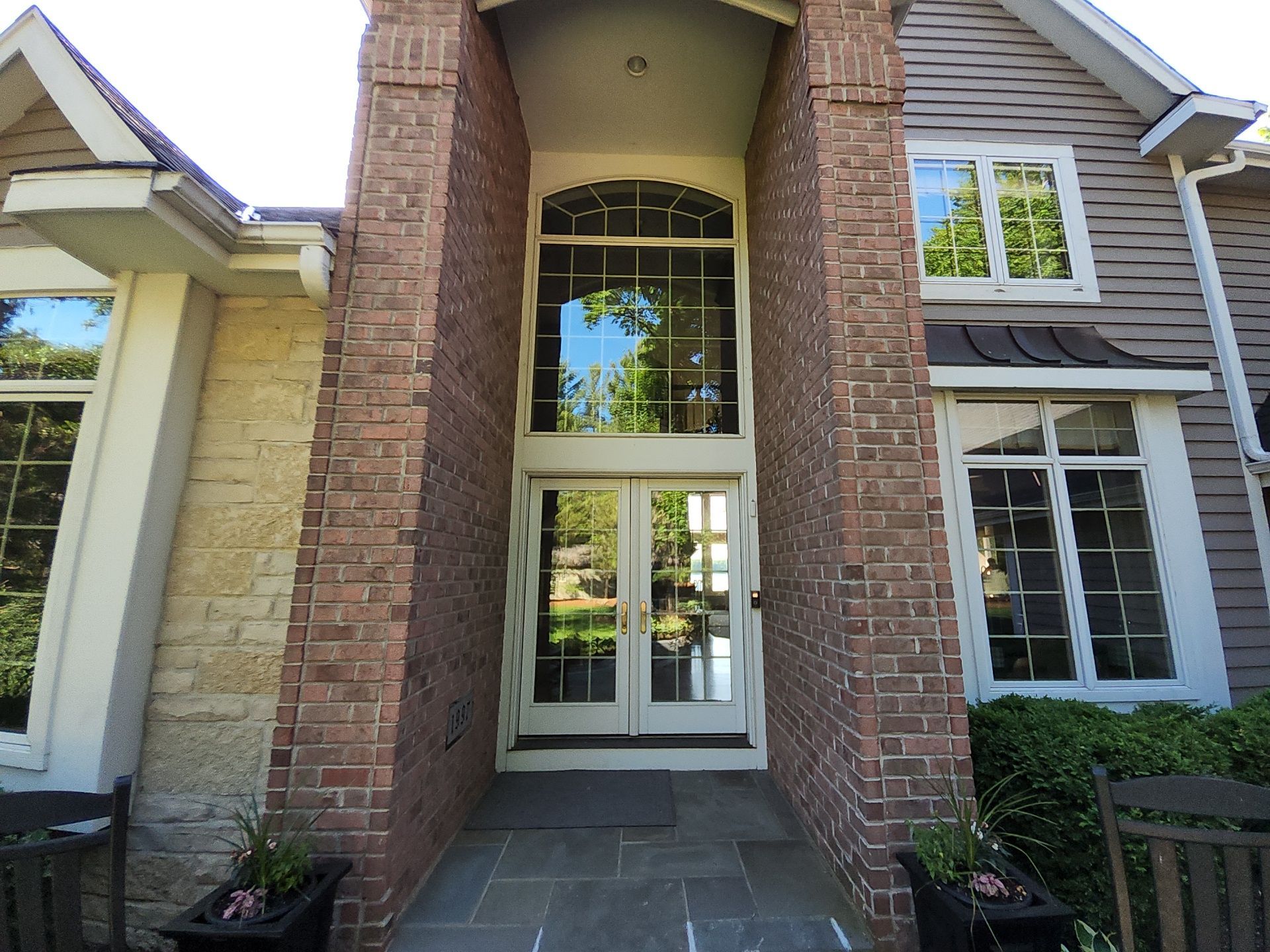 Brick front entry with painted trim at an Oconomowoc home