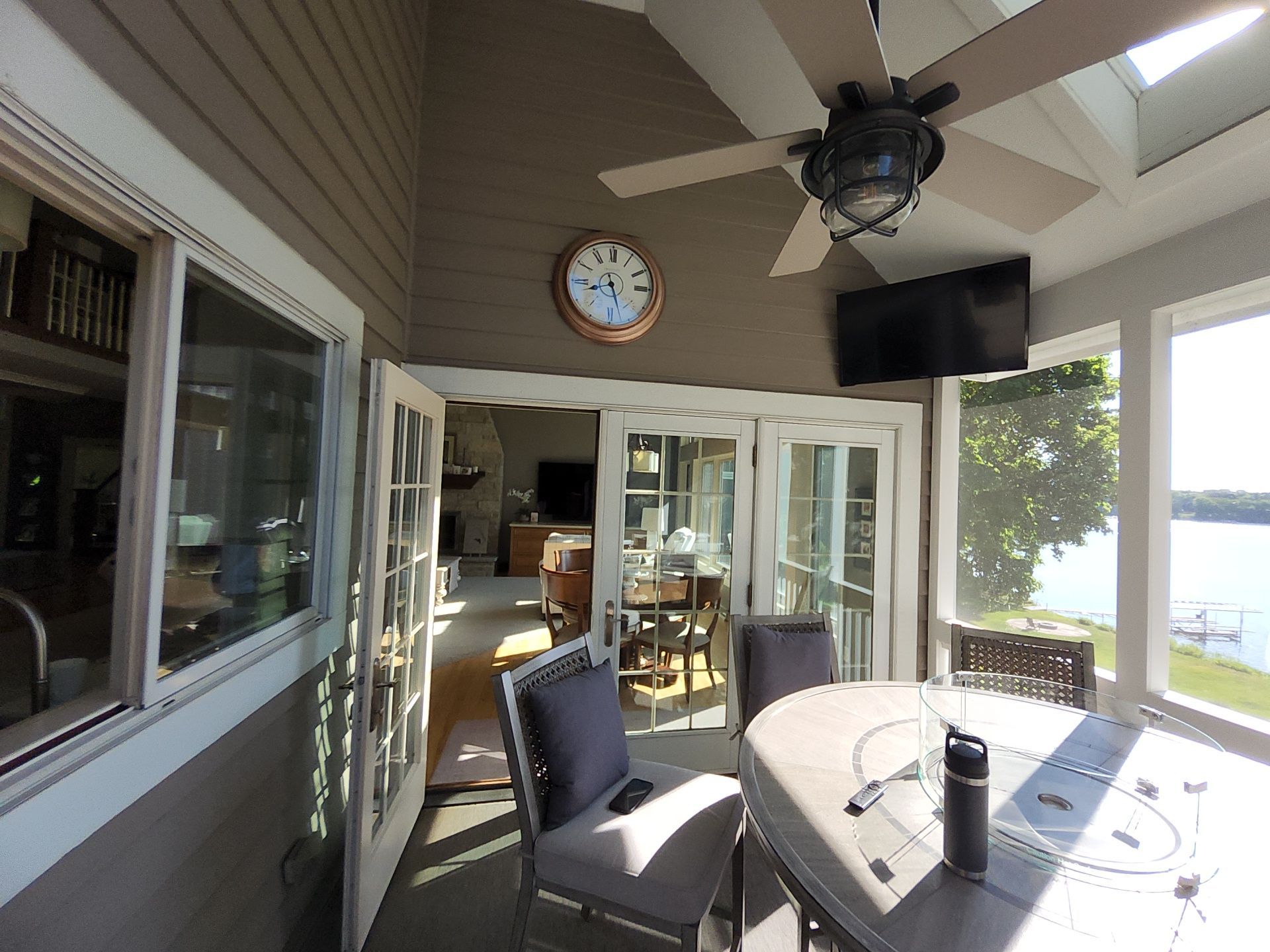 Lake-view screened porch with painted ceiling and trim