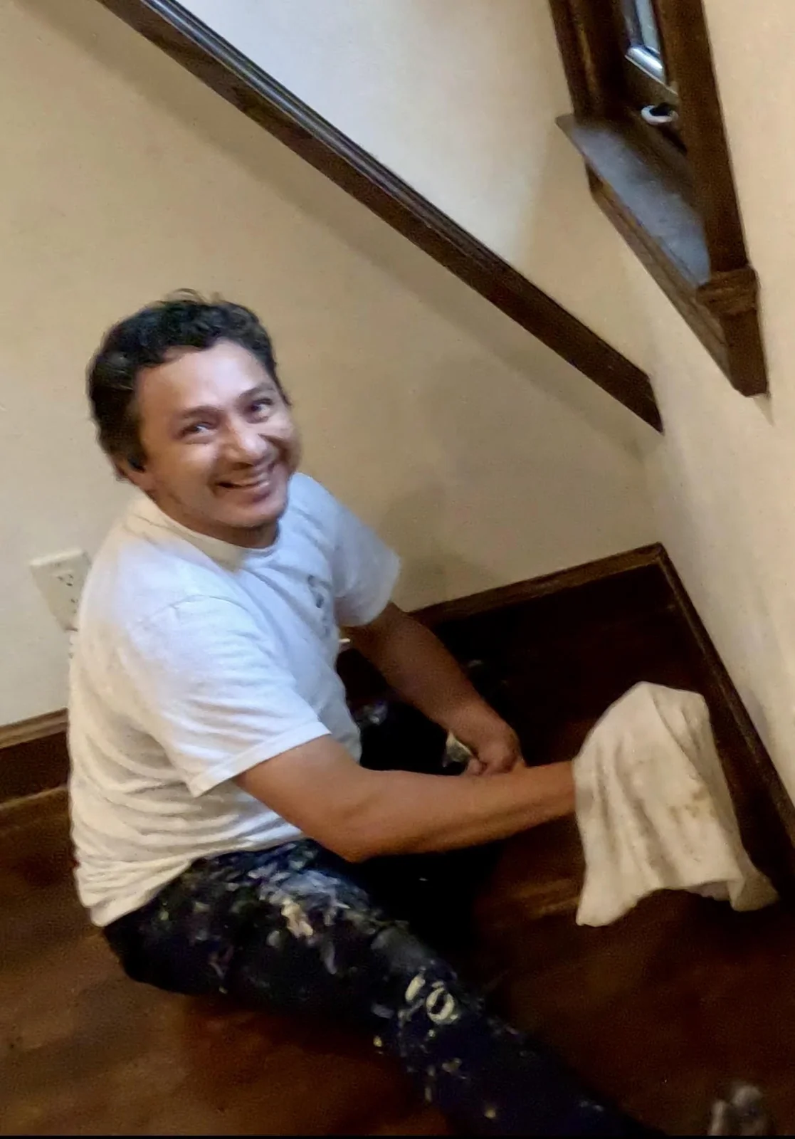 Empire team member working beside the stained staircase in Whitefish Bay