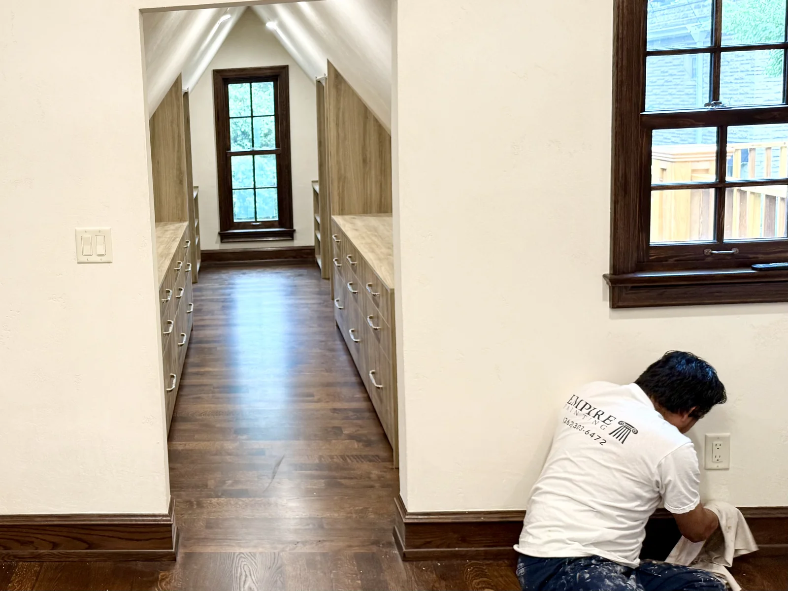 Empire team member working on interior wood trim in Whitefish Bay