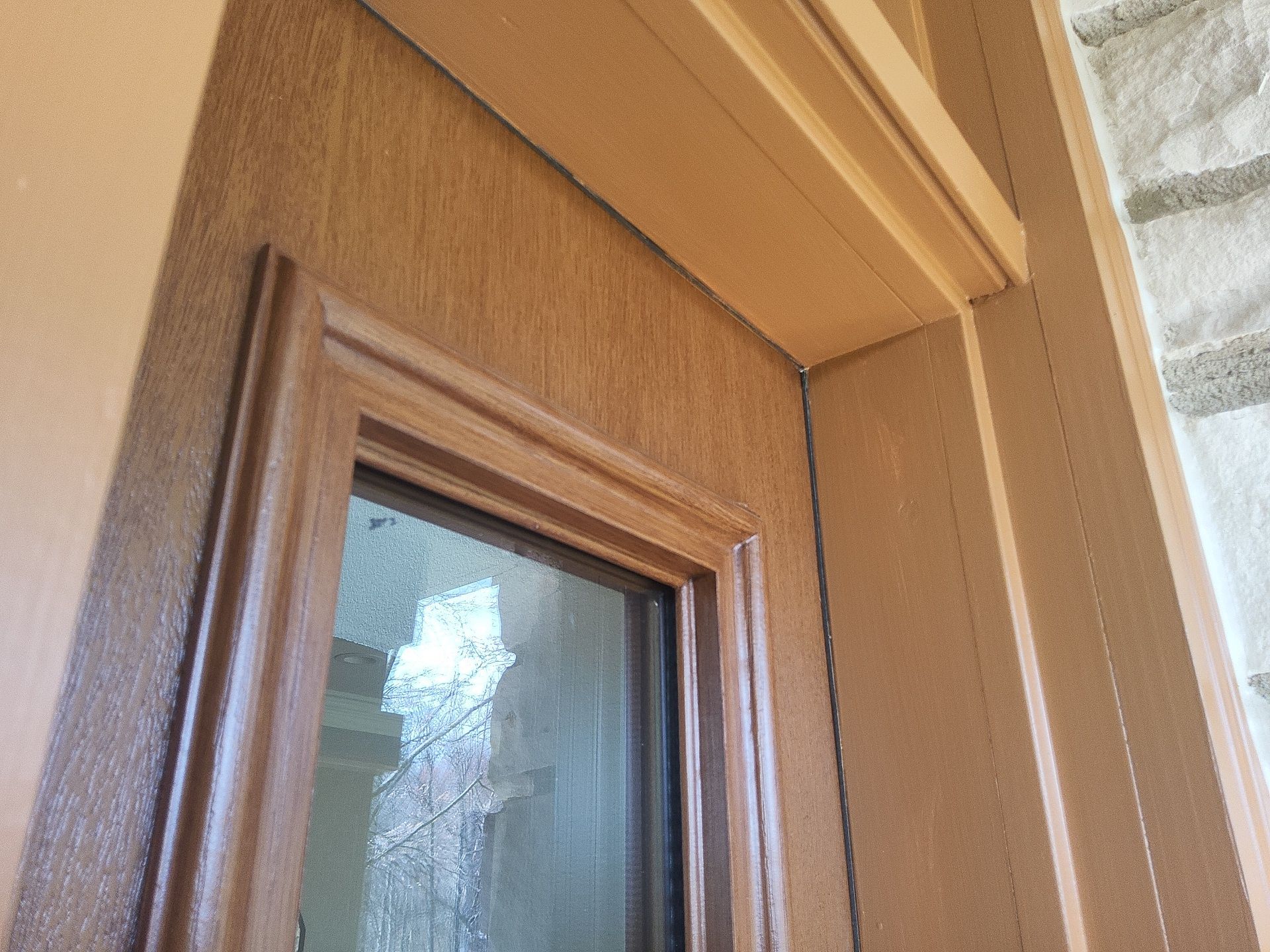 Wood entry door and sidelight detail at a Colgate home
