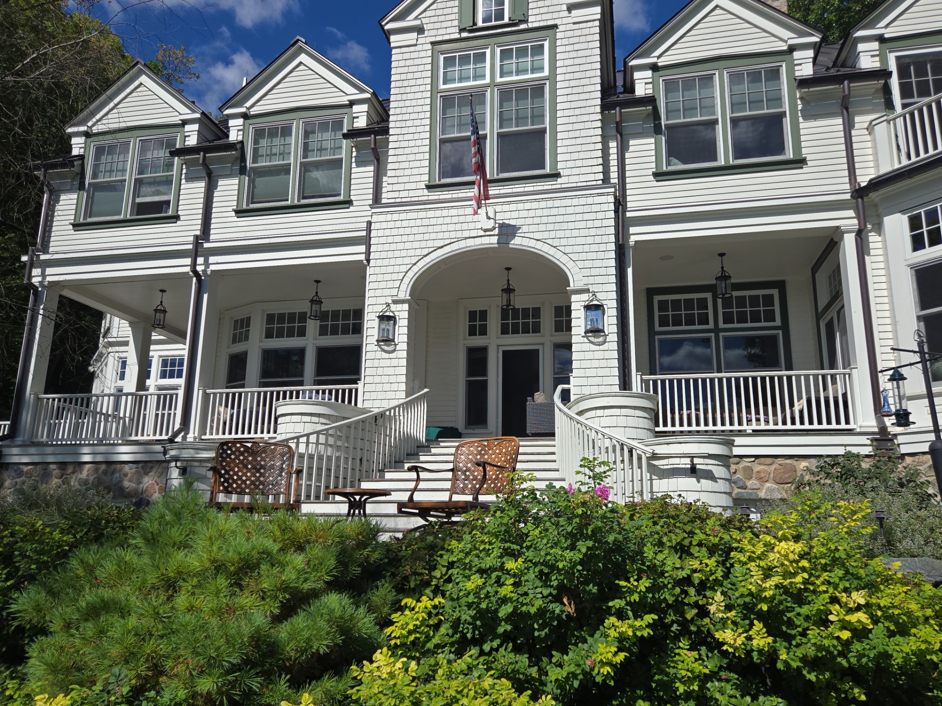 Cream siding, porch railings and trim at a West Bend home