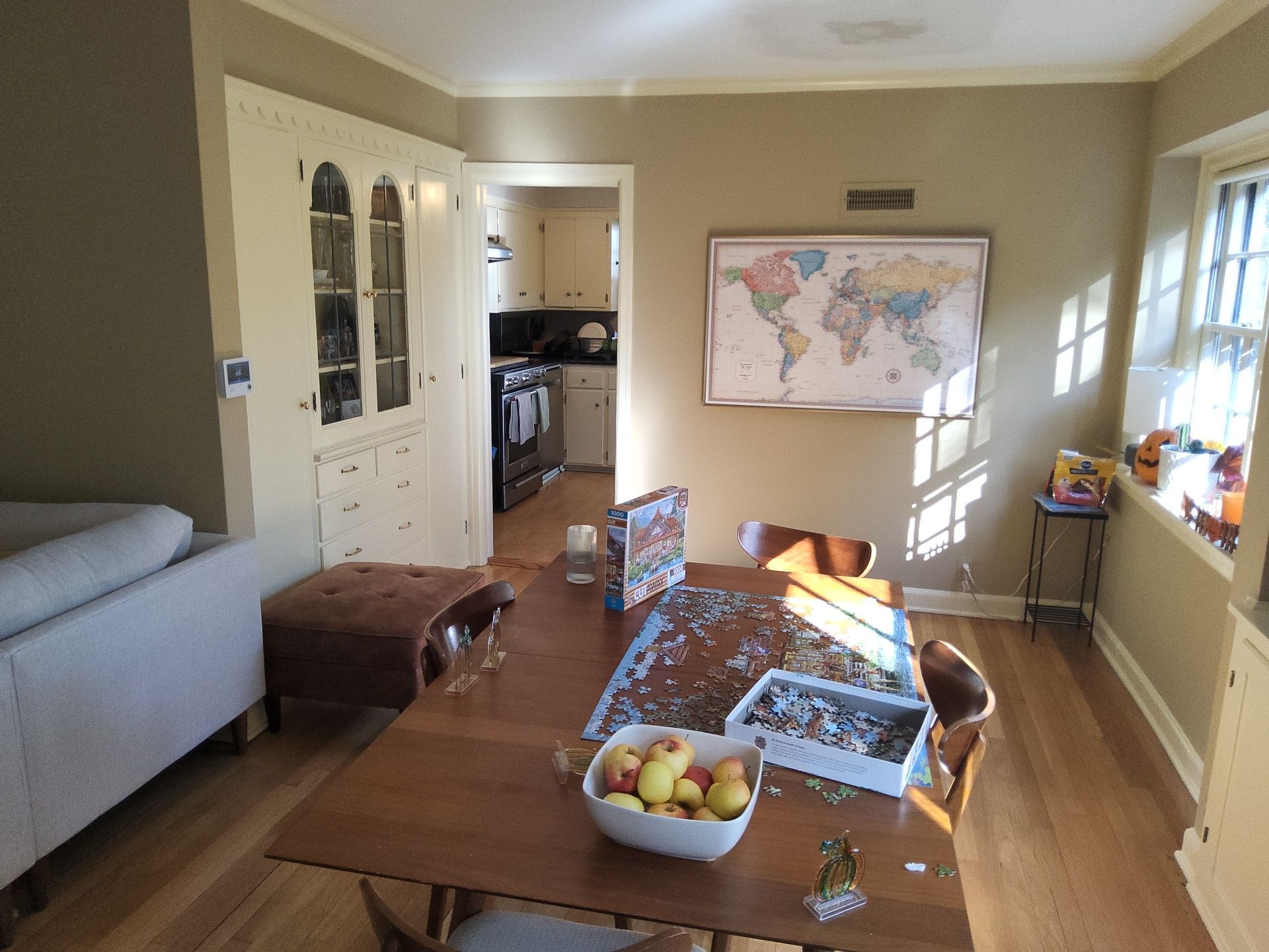 Wauwatosa dining room with warm walls, white built-ins and window trim