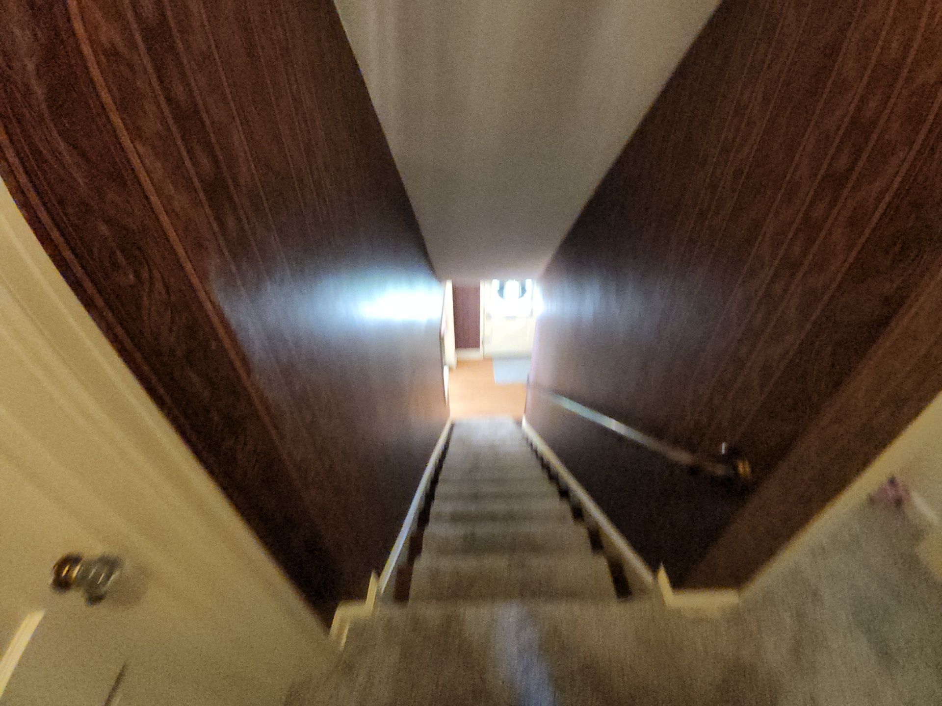 Wauwatosa stairway during surface preparation with protected steps and taped trim