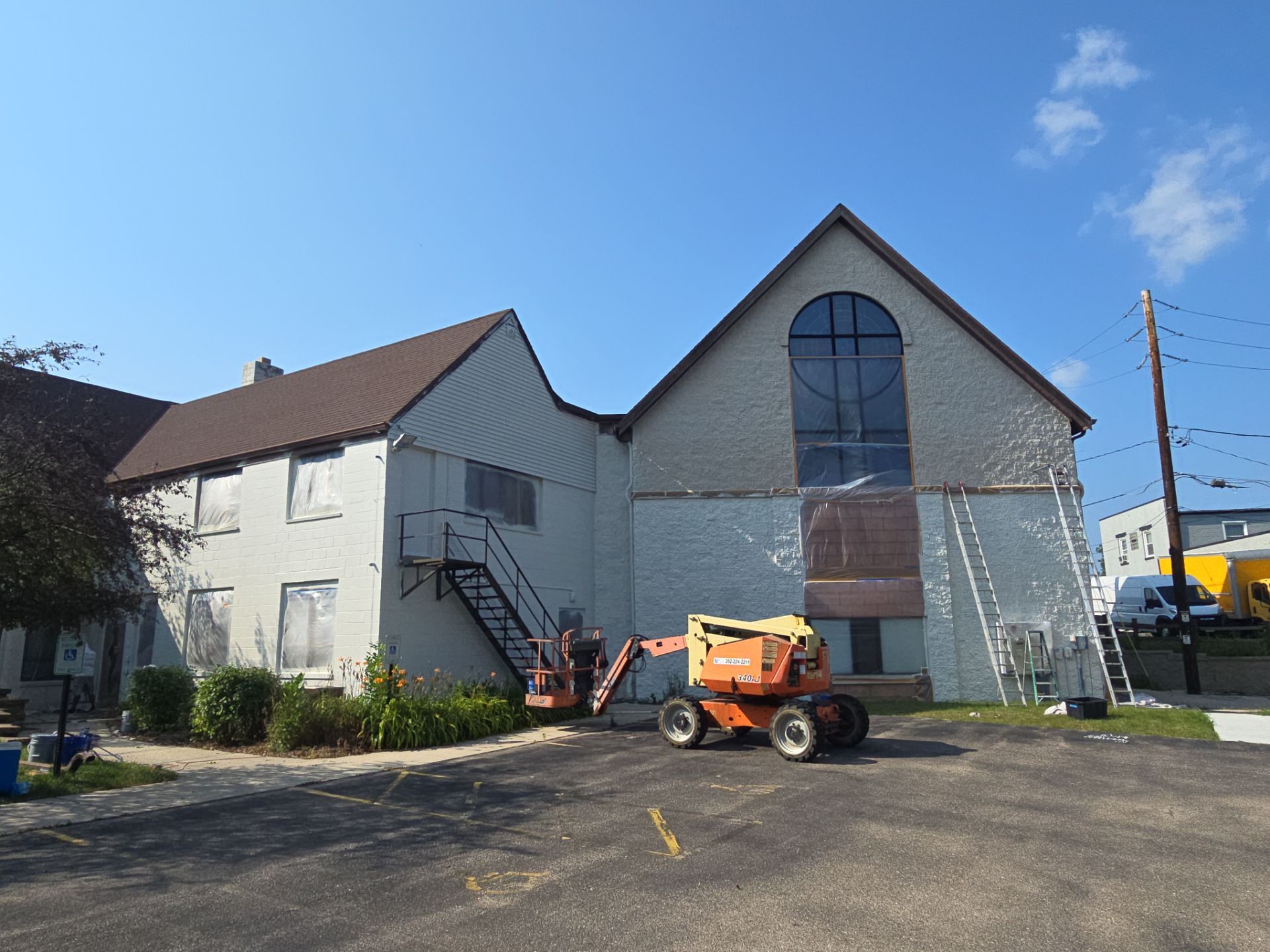 Exterior painting in progress at Martin Luther Lutheran Church in Milwaukee