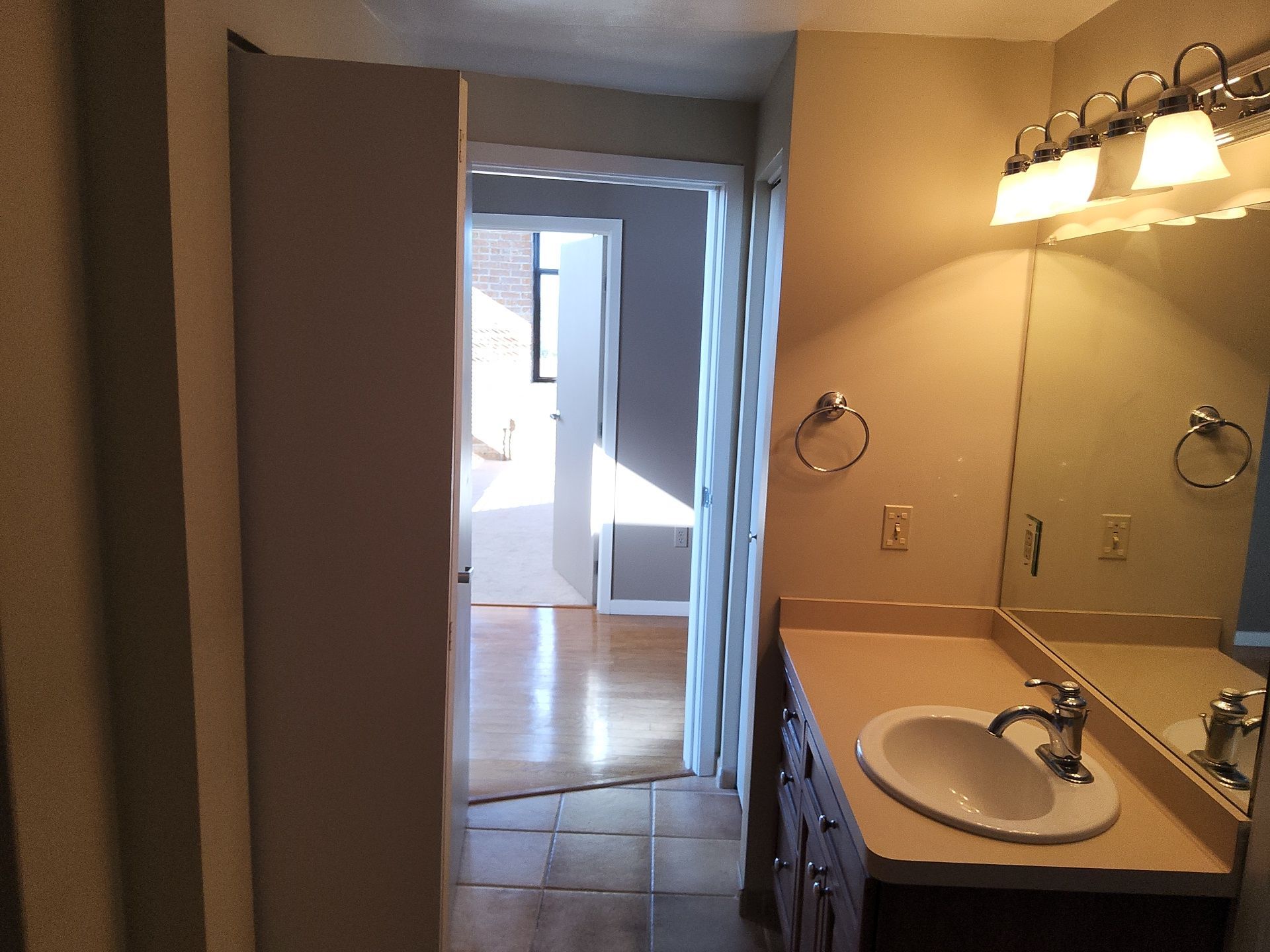 Painted bathroom walls and white doorway trim in a Milwaukee condo