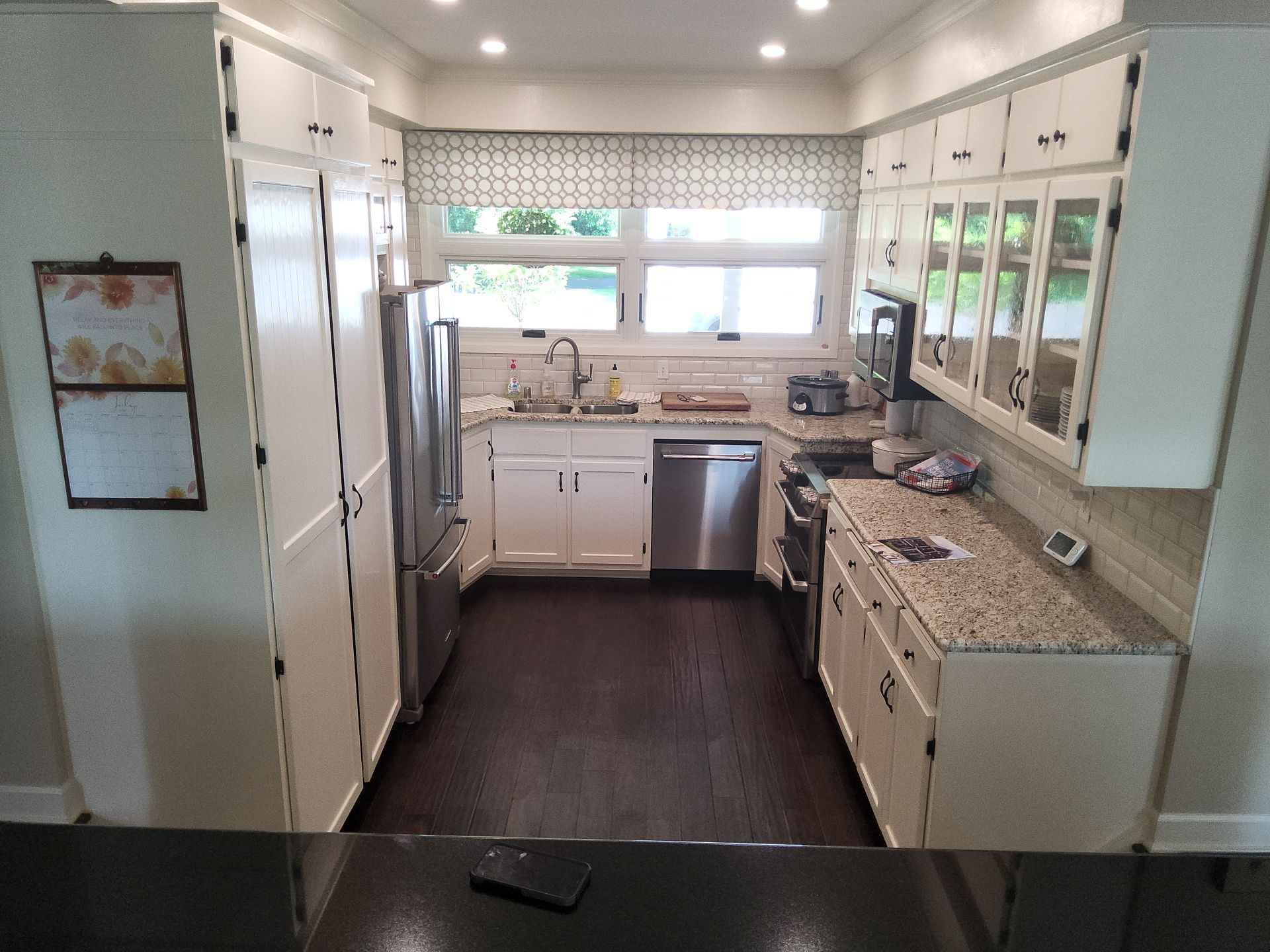 Franklin kitchen with white cabinets, dark hardware and light walls