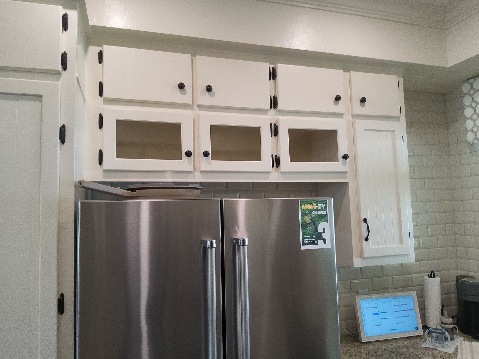 White kitchen cabinet doors and dark hardware at a Franklin home