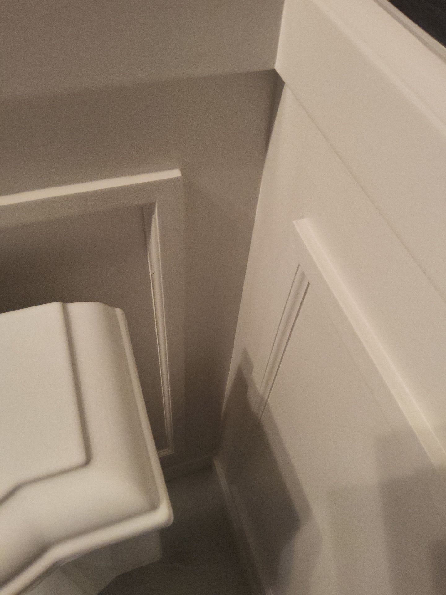 Bathroom wall and white panel trim detail at a Colgate home