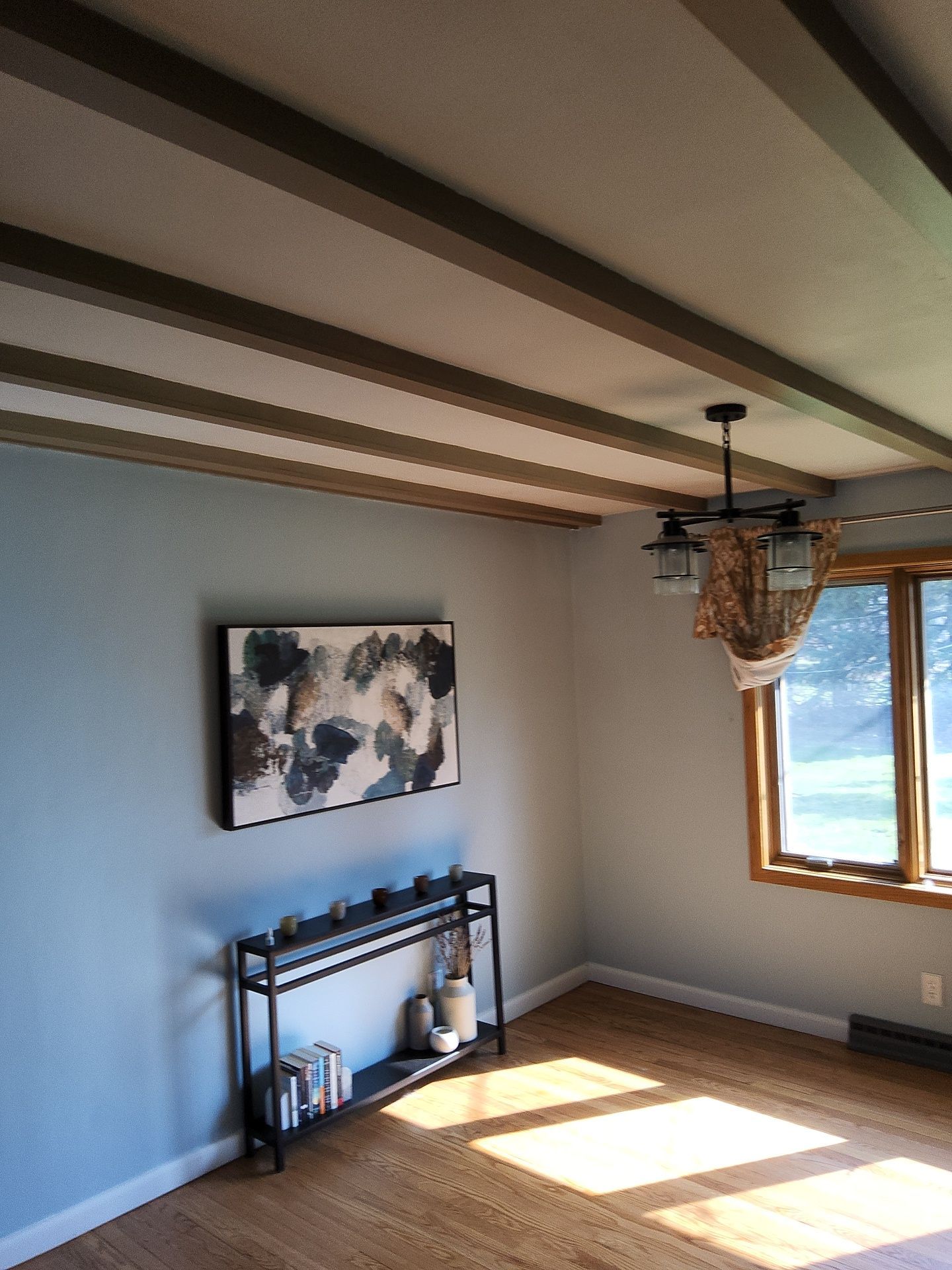 Franklin residential interior with blue-gray walls and exposed ceiling beams
