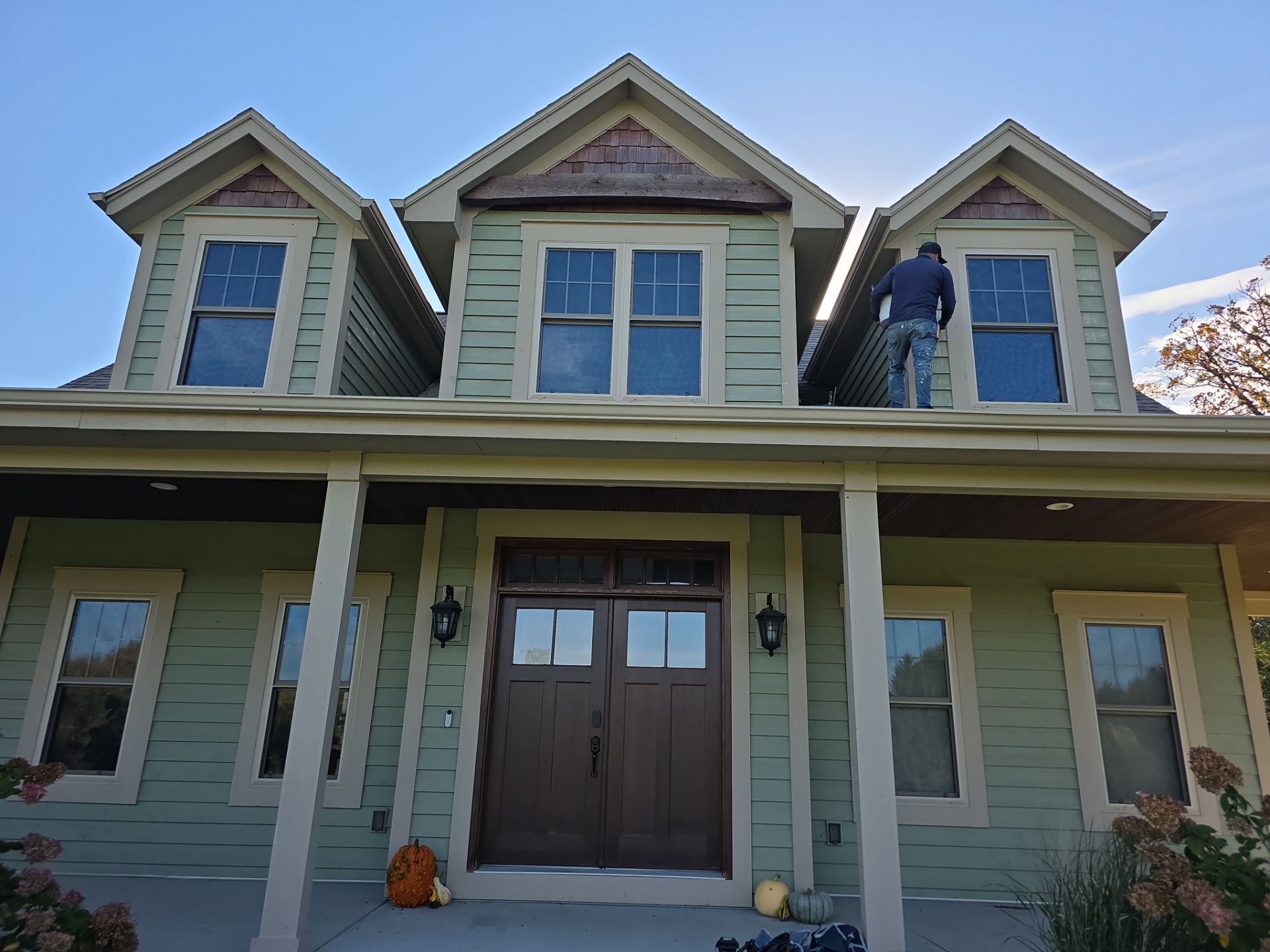 Front porch and dormer painting in progress at a Dousman home