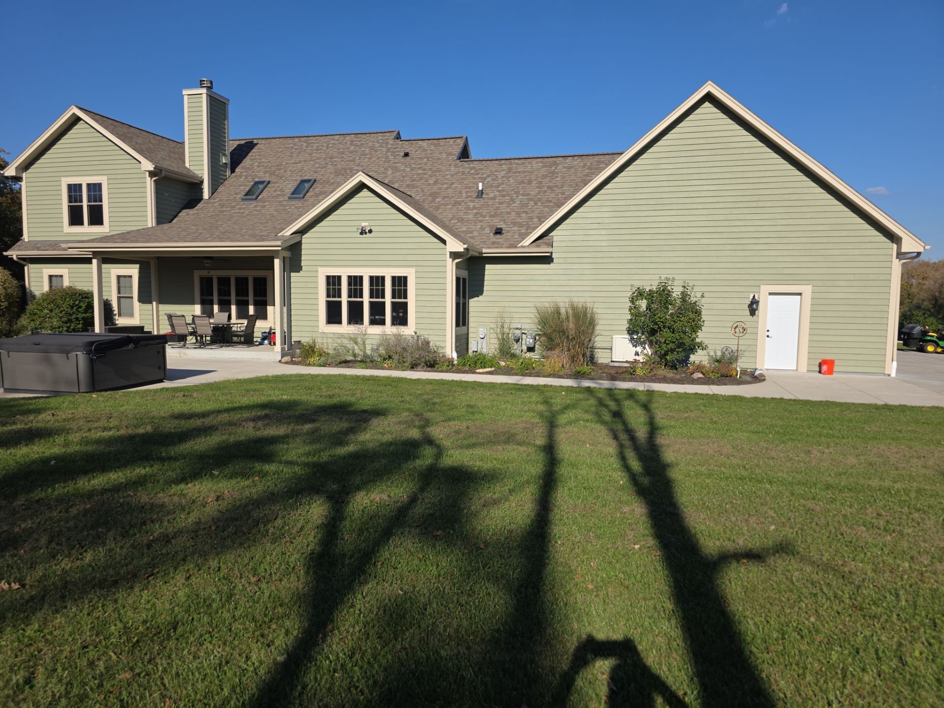 October 22 rear view of the Dousman home with green siding and cream trim
