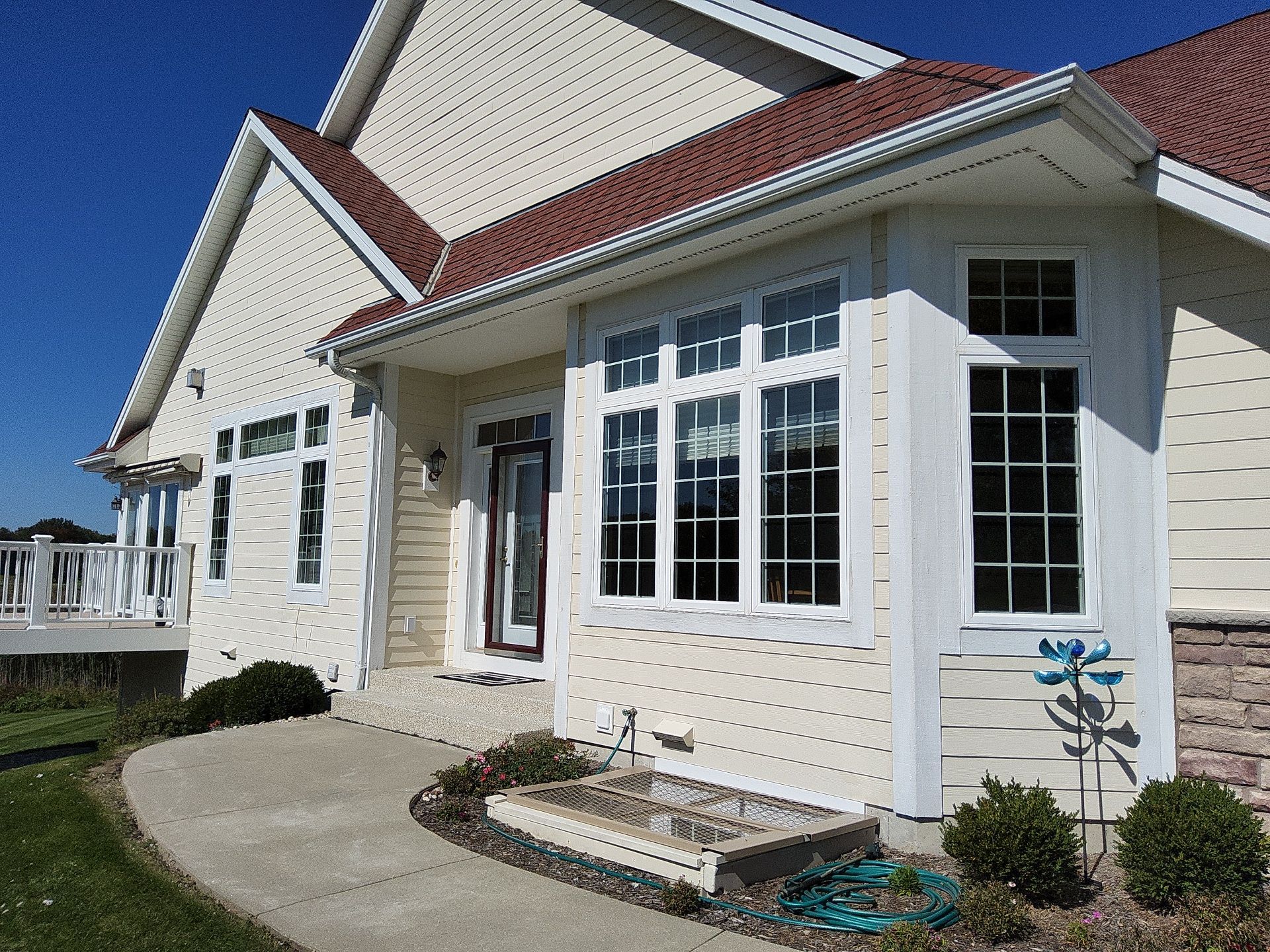 Deer Creek condominium exterior with white trim and tall windows
