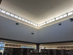 USS Liberty Memorial Library · view 1 — Community library project archive — interior space and painted details.