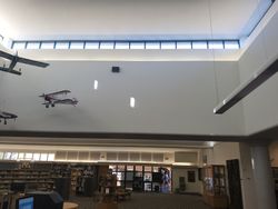 USS Liberty Memorial Library · view 2 — Community library project archive — interior space and painted details.