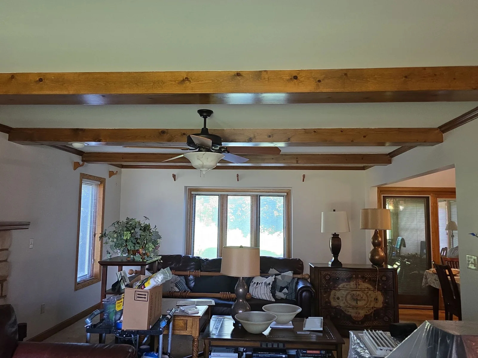 During the interior project: living-room walls and ceiling around the existing wood beams.