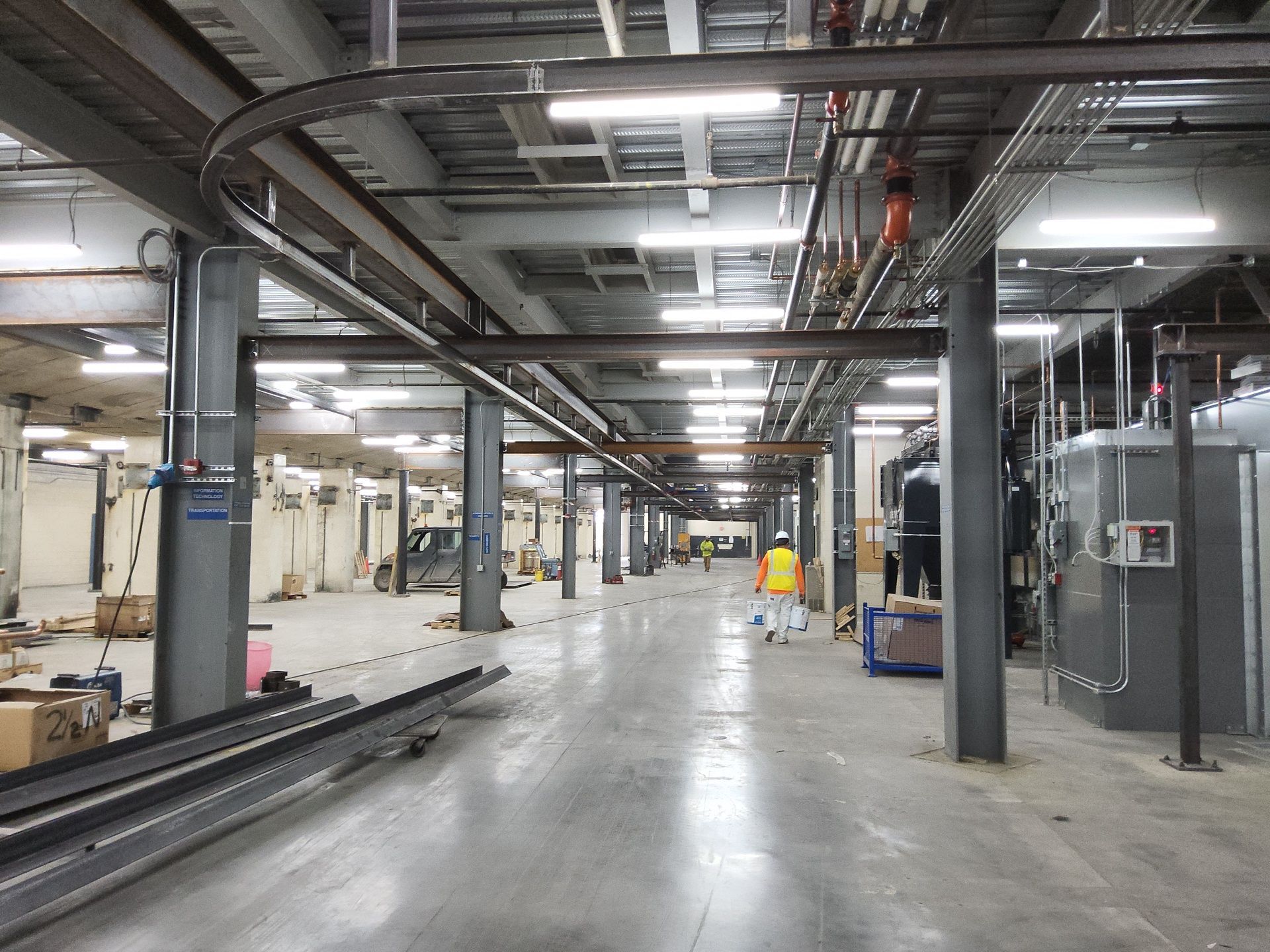 Painting work underway inside a large Milwaukee industrial facility