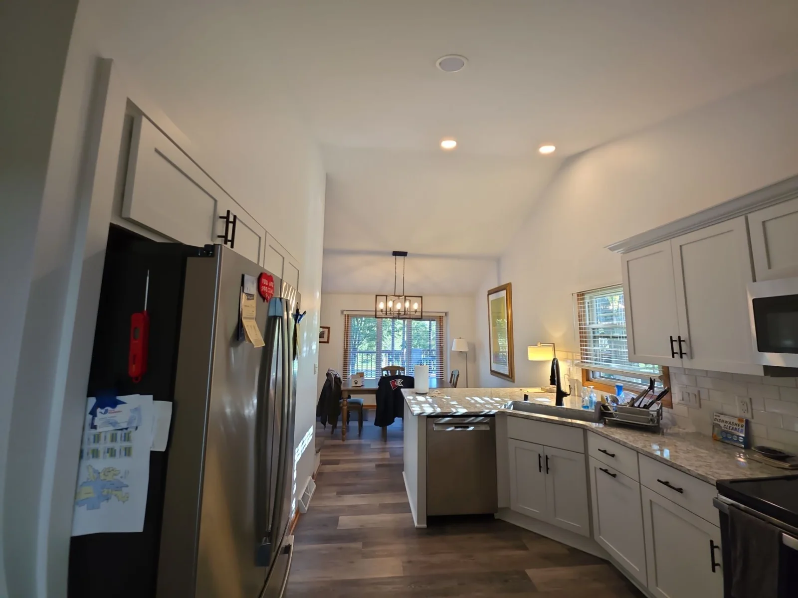 Wide kitchen view toward the window and adjoining living space